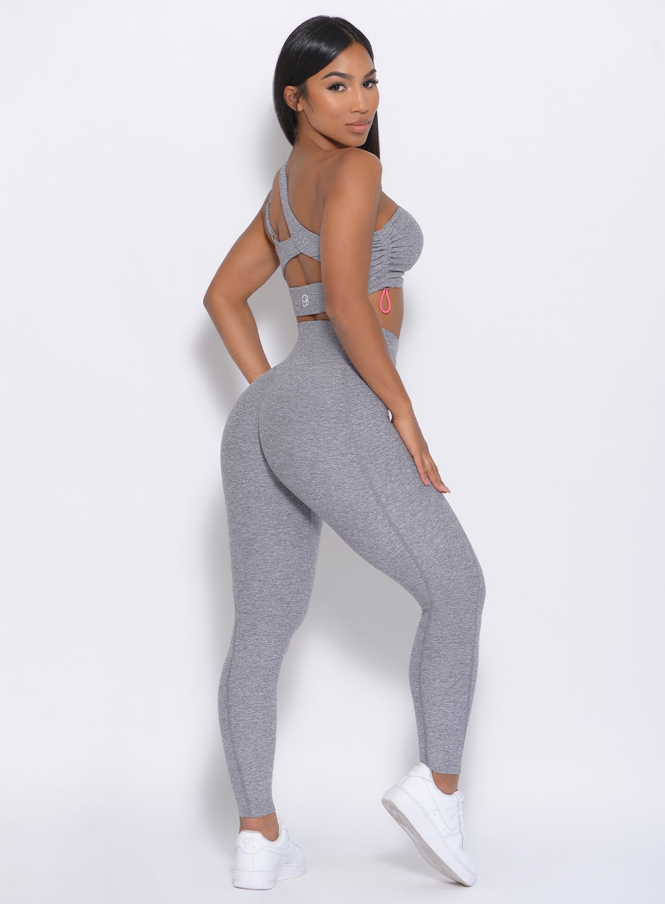 Right side view of the model in our Brazilian Contour Legging in cloud color and a matching bra