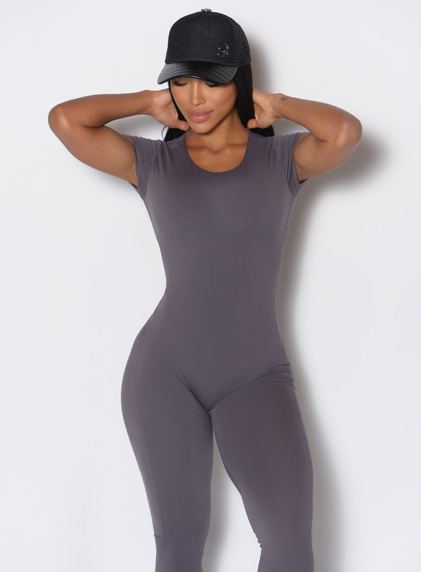 front view of model wearing our black denim crocodile hat complemented by a gray bodysuit