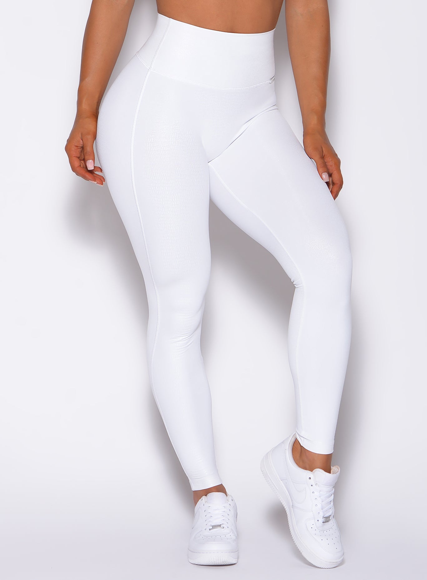 Zoomed in front profile view of our shine leggings in white python color