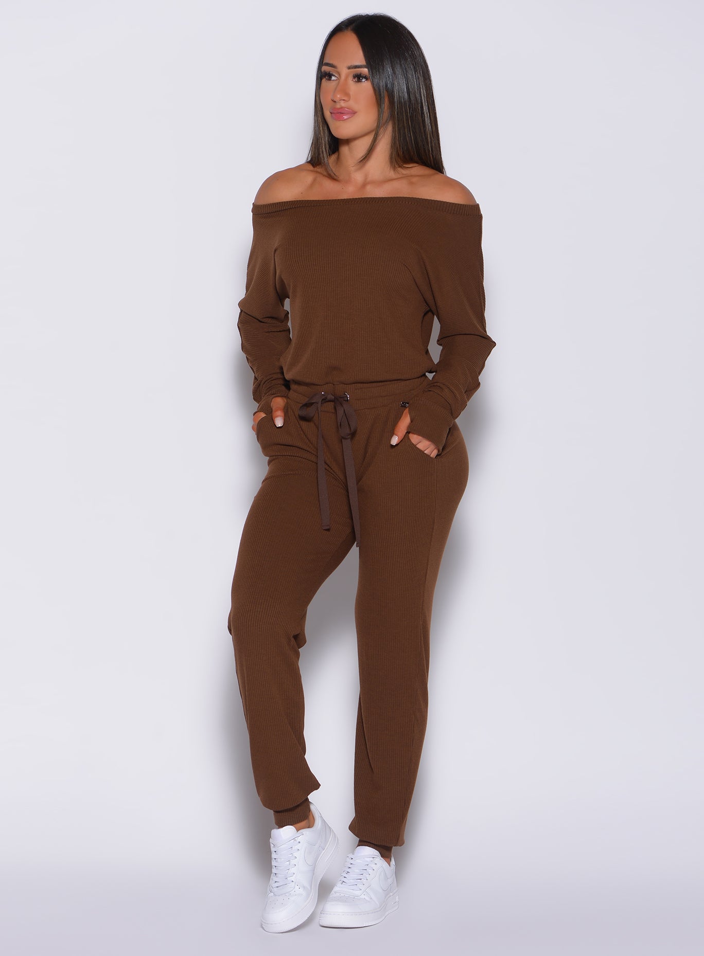 Model facing forward wearing our rib jumpsuit in expresso color