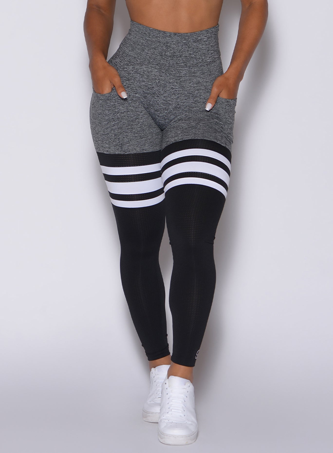 Front side close up view of model wearing our scrunch thigh high in gray and black
