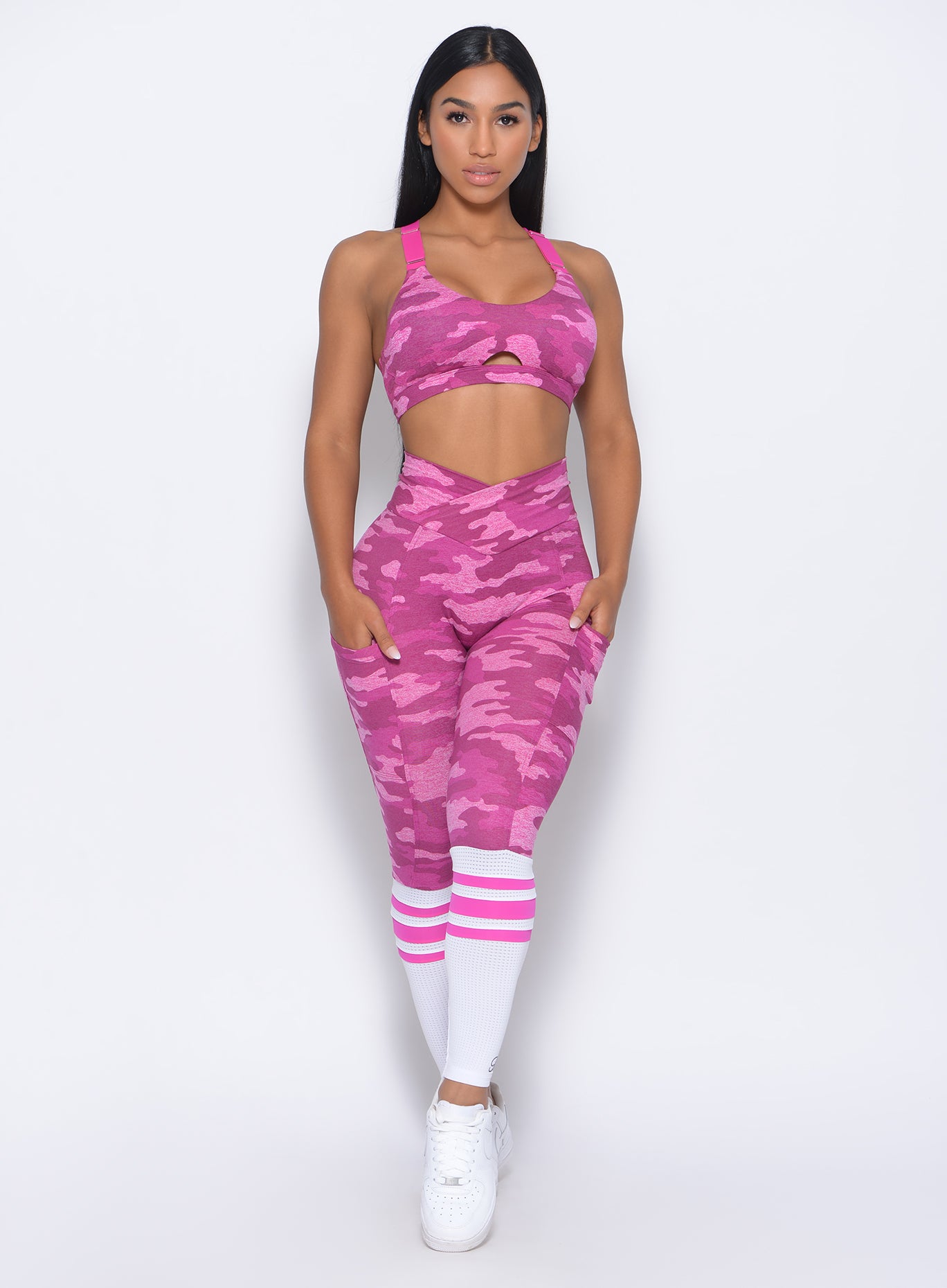 Front profile view of the model in our pink camo contour sock leggings and a matching bra