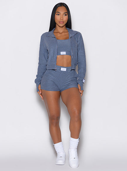 Front view of model wearing twilight lounge full length jacket, bra, and shorts